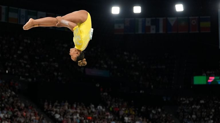 Rebeca Andrade, of Brazil, performs on the balance beam during...