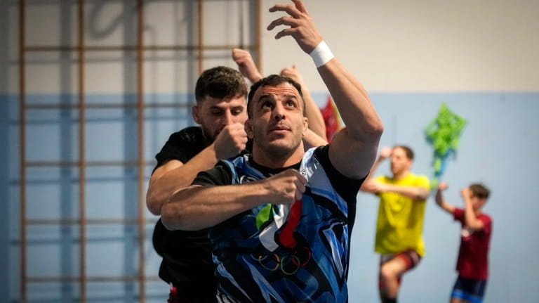 Iranian wrestler Iman Mahdavi, 28, practices at the Lotta Club...