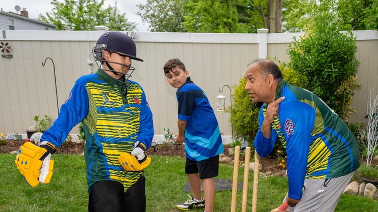 Brothers Aleem Butt, 11, and Kamran Butt, 9, learn to...