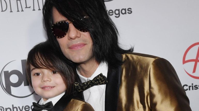 Johnny Crisstopher Sarantakos, 5, and illusionist Criss Angel at Planet...