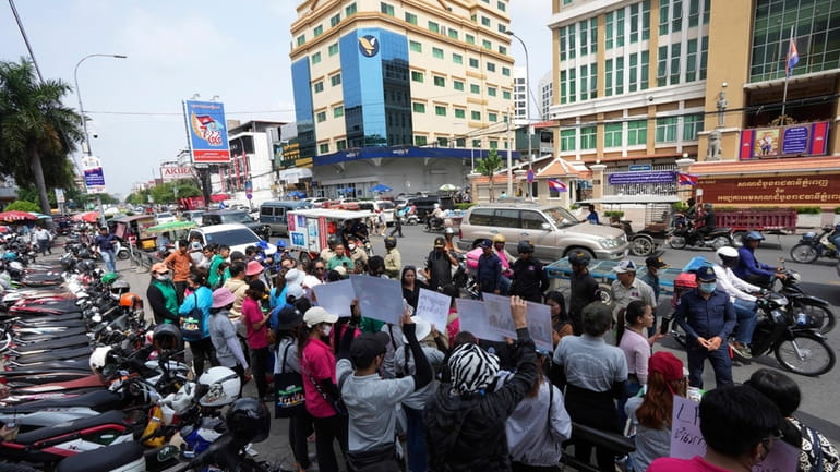 Supporters of NagaWorld's union leader Chhim Sithar hold a protest...