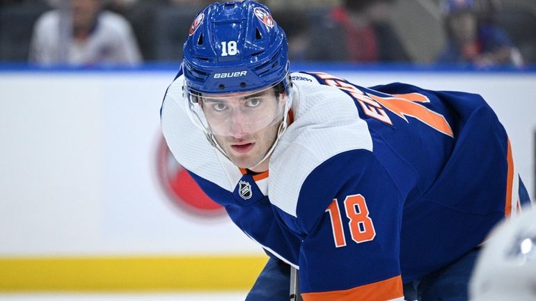 Islanders left wing Pierre Engvall sets before a faceoff against...