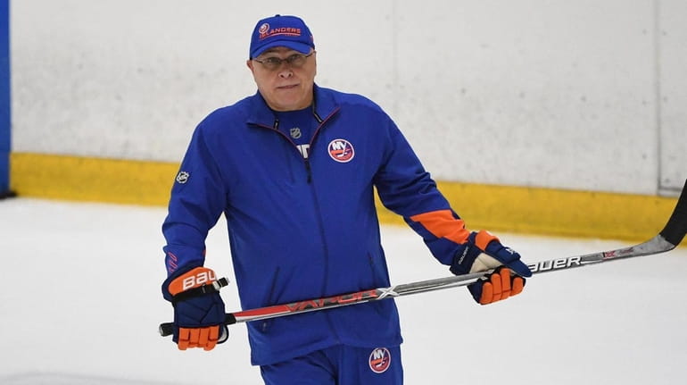 Islanders head coach Barry Trotz skates during training camp at...