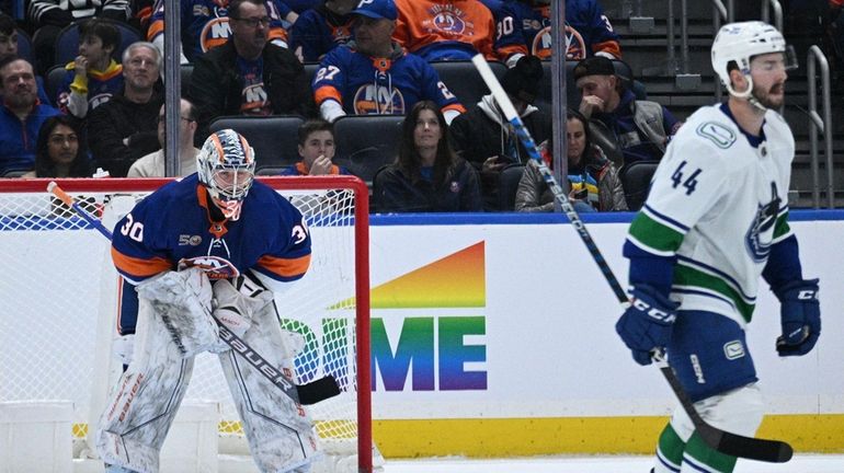 Islanders goaltender Ilya Sorokin looks on after Canucks defenseman Oliver...