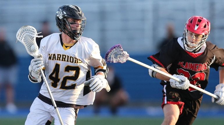 Wantagh's Jake Martini (42) tries to get by Plainedge's Jaxson...