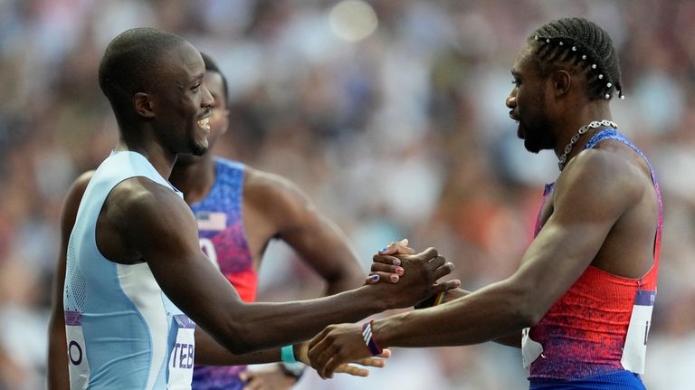 Gold medalist Letsile Tebogo, of Botswana, and bronze medalist Noah...