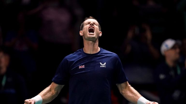 Great Britain's Andy Murray celebrates beating Switzerland's Leandro Riedi during...