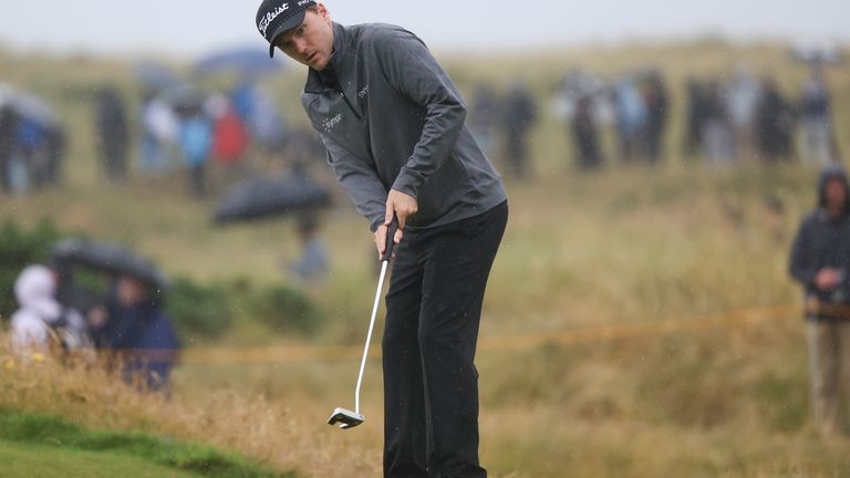 Russell Henley of the United States putts on the 13th...