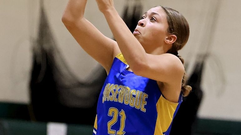 Comsewogue forward Jayla Callender drives the lane for two points...