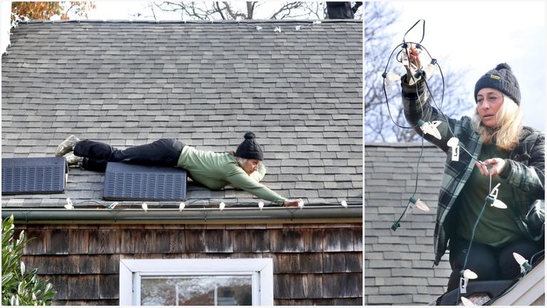 Courtney Walters of Blinky's Christmas lights installs decorations on Vincent Manzo's home...