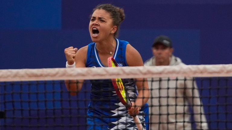 Jasmine Paolini of Italy celebrates after defeating Ana Bogdan of...