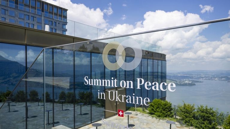 The logo of the peace summit is pictured in Buergenstock,...