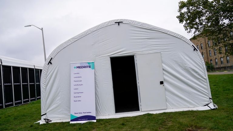 A tent that will be used for laundry is seen...