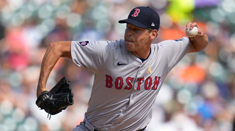 Boston Red Sox pitcher Rich Hill throws against the Detroit...