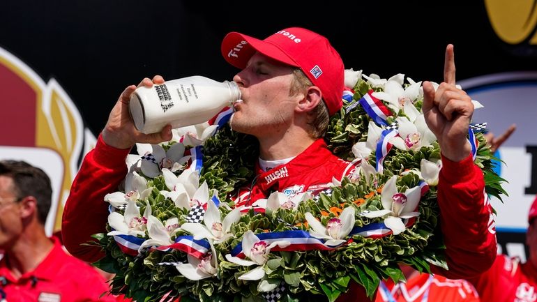 Marcus Ericsson, of Sweden, celebrates after winning the Indianapolis 500...