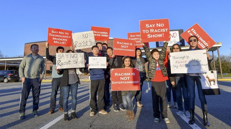 Protesters pose for group shot before being asked to leave...