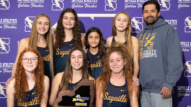 The Sayville cross country state championship team poses for a...
