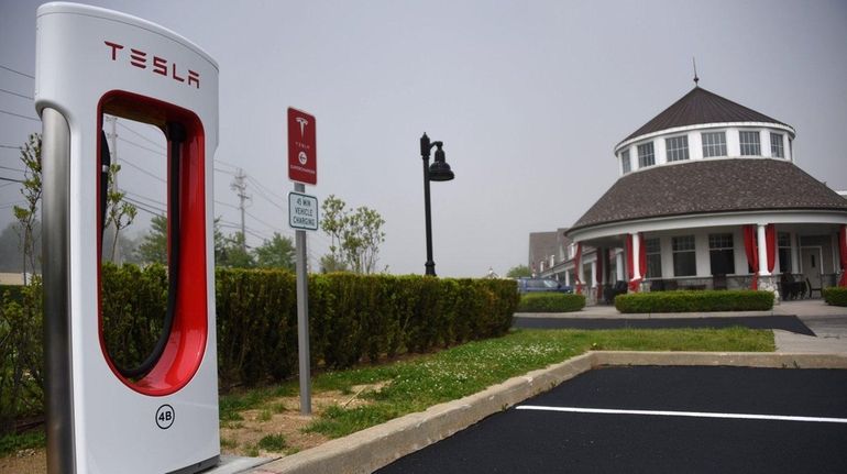 Tesla Motors is setting up a charging station outside Cafe...