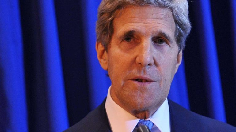 Secretary of State John Kerry speaks during a press conference...