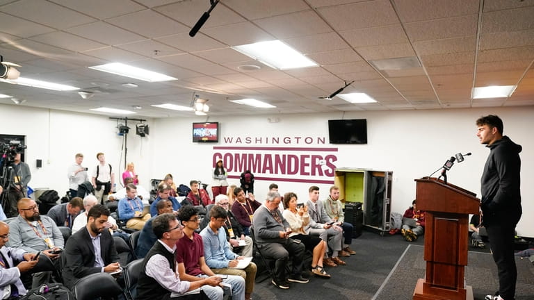 Washington Commanders quarterback Sam Howell speaking to media at the...