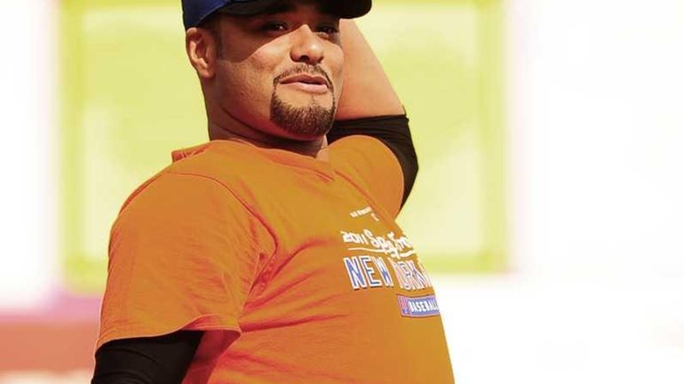 Johan Santana warms up his arm during today's spring training...