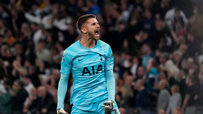 Tottenham's goalkeeper Guglielmo Vicario celebrates after Liverpool's Joel Matip scored...