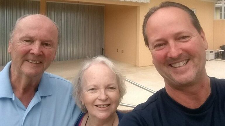 John Cronin of East Northport, with his parents, Chester and...