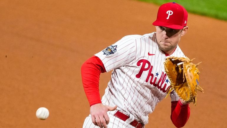 Philadelphia Phillies first baseman Rhys Hoskins fields a Houston Astros...