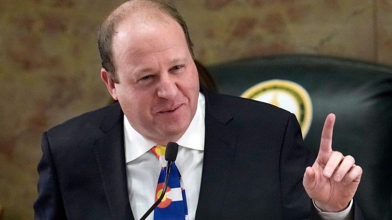 Colorado Gov. Jared Polis in the House of Representatives chamber...