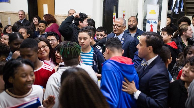 State Sen. Robert Jackson (D-Manhattan), top center, looks on as Westbury...