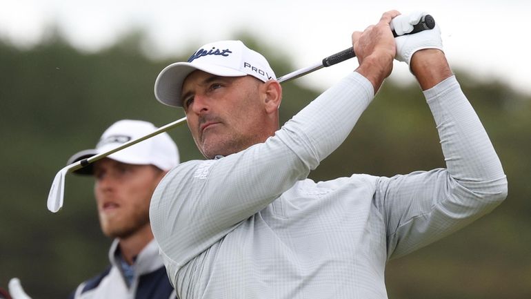 Michael Henry of New Zealand watches his tee shot on...