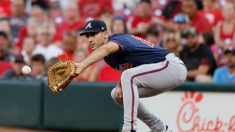 Atlanta Braves first baseman Matt Olson catches the ball to...