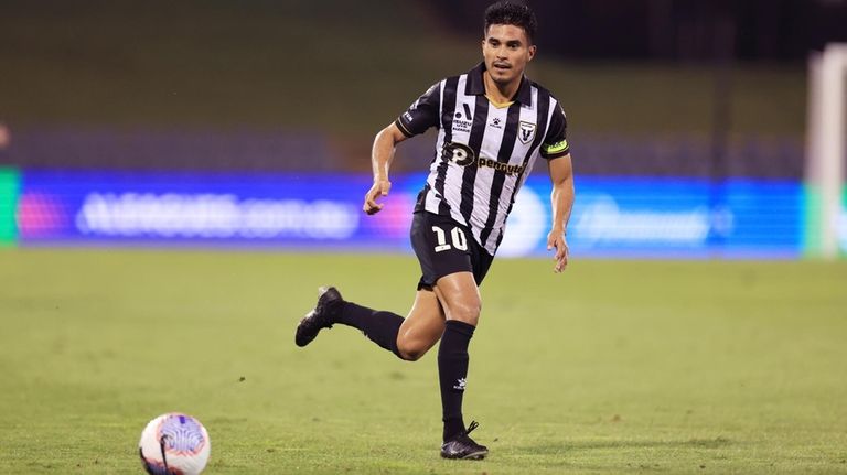 Macarthur FC player Ulises Davila passes the ball during an...