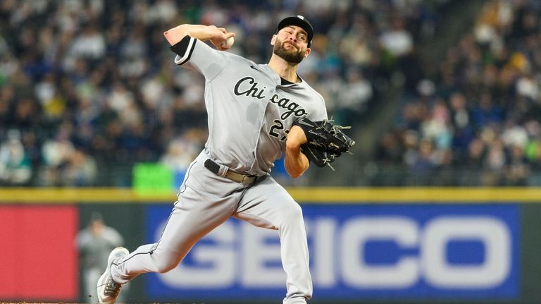 Chicago White Sox starting pitcher Lucas Giolito throws against the...