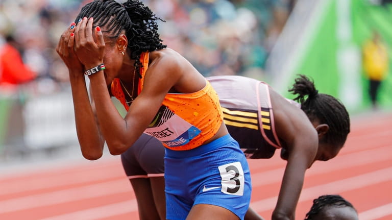 Beatrice Chebet of Kenya, sets a world record in the...