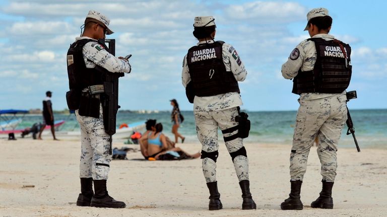 Members of the National Guard (Guardia Nacional de México) patrol...