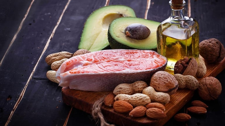 Salmon, avocado, olive oil  and nuts  provide healthy fats.