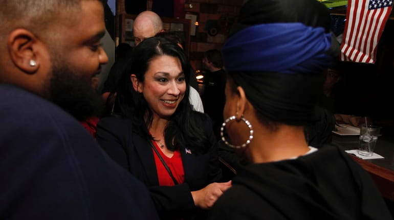 Kelly Convirs-Fowler greets her supporters as results come in Tuesday,...