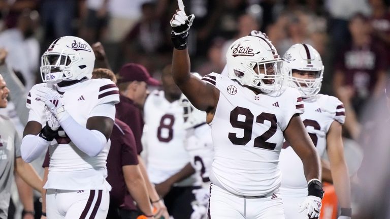 Mississippi State defensive lineman Eric Taylor (92) celebrates their 31-24...