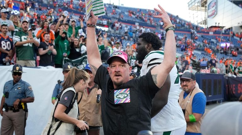 Jets offensive coordinator Nathaniel Hackett, front center, who was fired...