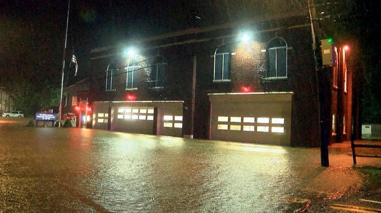 Port Jefferson is heavily flooded as the the remnants of...