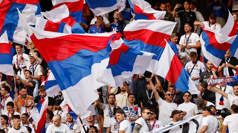 Lyon fans cheer for their team before the French League...