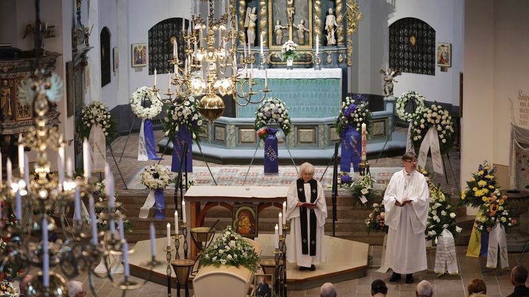 People attend the funeral service of Swedish soccer manager Sven-Goran...