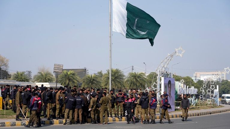 Security personnel try to stop protest of supporters of imprisoned...