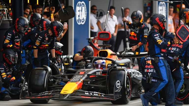 Red Bull driver Max Verstappen of the Netherlands gets a...