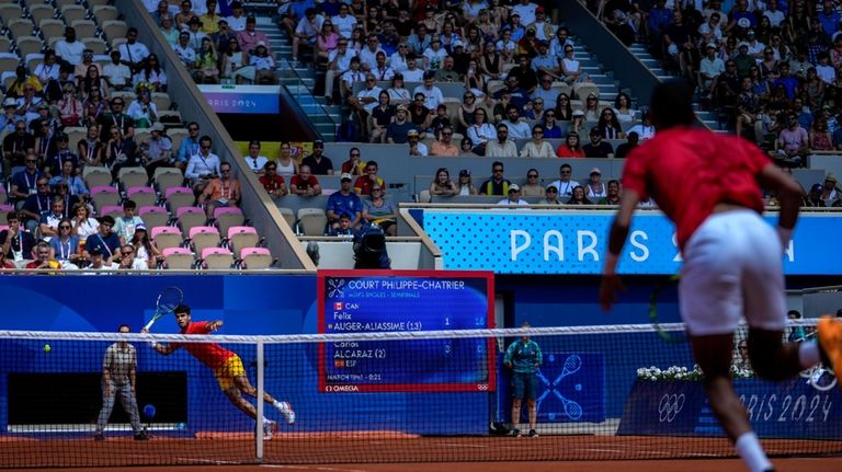 Carlos Alcaraz of Spain plays against Felix Auger-Aliassime of Canada...