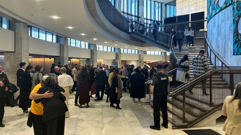 People arrive at Parliament in Wellington, New Zealand, on Wednesday,...