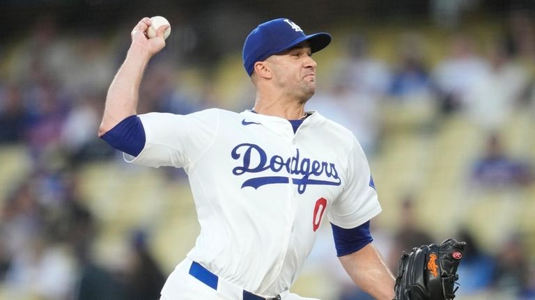 Los Angeles Dodgers starting pitcher Jack Flaherty throws during the...