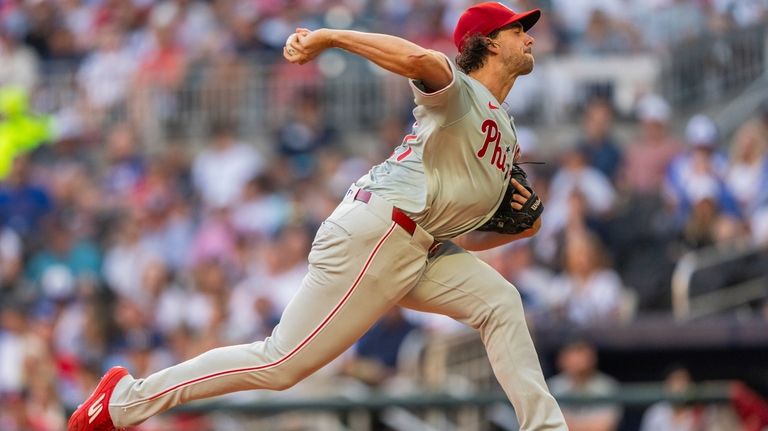 Philadelphia Phillies pitcher Aaron Nola throws in the first inning...