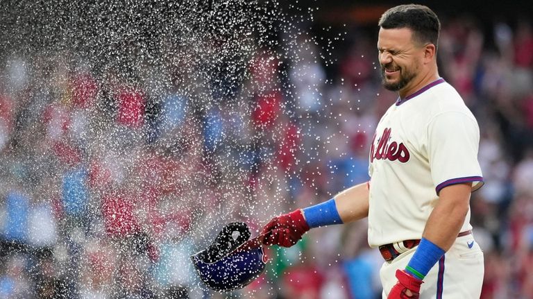 Philadelphia Phillies' Kyle Schwarber is doused by Alec Bohm after...